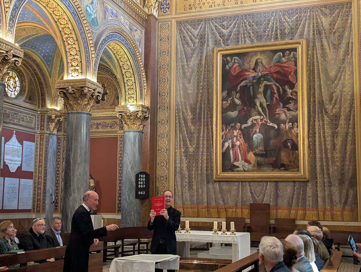 Venerable English College rector, Fr. Stephen Wang, is presented with a copy of the Positio